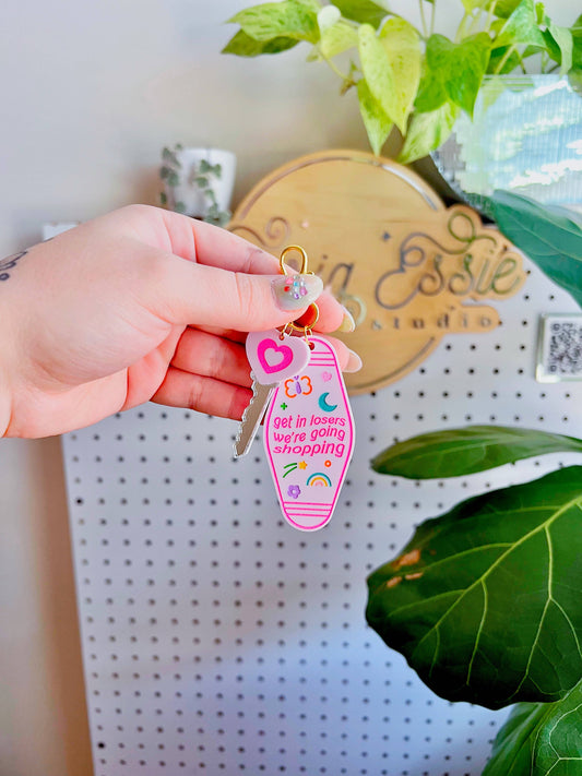 Get in losers, we're going shopping Motel Keychain